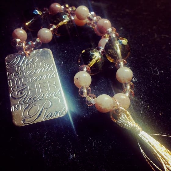 Image of "SHE turned her CAN'TS into CANS and HER dreams into PLANS"