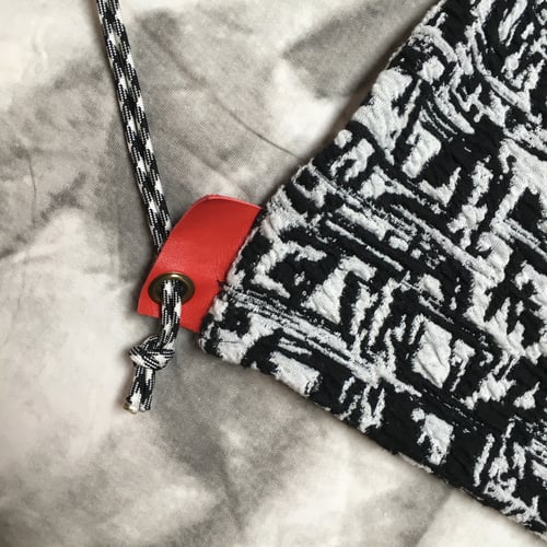 Image of Black White and Red All-Over Drawstring Backpack