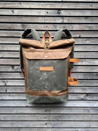 Image 1 of Waxed canvas backpack with detachable leather side straps and padded shoulder straps