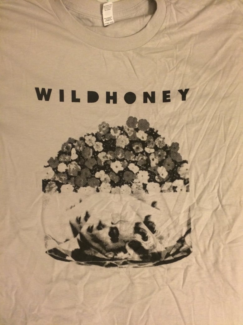 Image of flowers in a vase with a face T Shirt