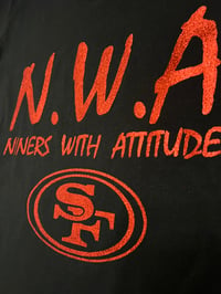 Image 3 of WOMEN’S N.W.A BLACK V-NECK SHIRT, SHINY GLITTER RED LETTERS