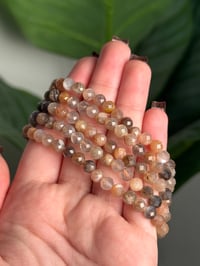 Image 2 of FACETED PEACH MOONSTONE BEADED BRACELETS 5MM