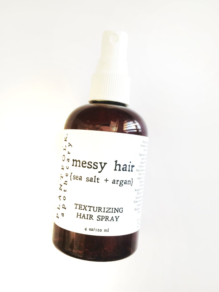 Image of messy hair {sea salt + argan} texturizing hair spray