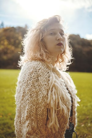 Image of perth merino wool hand knit cardigan (shown in natural w/ fringe)