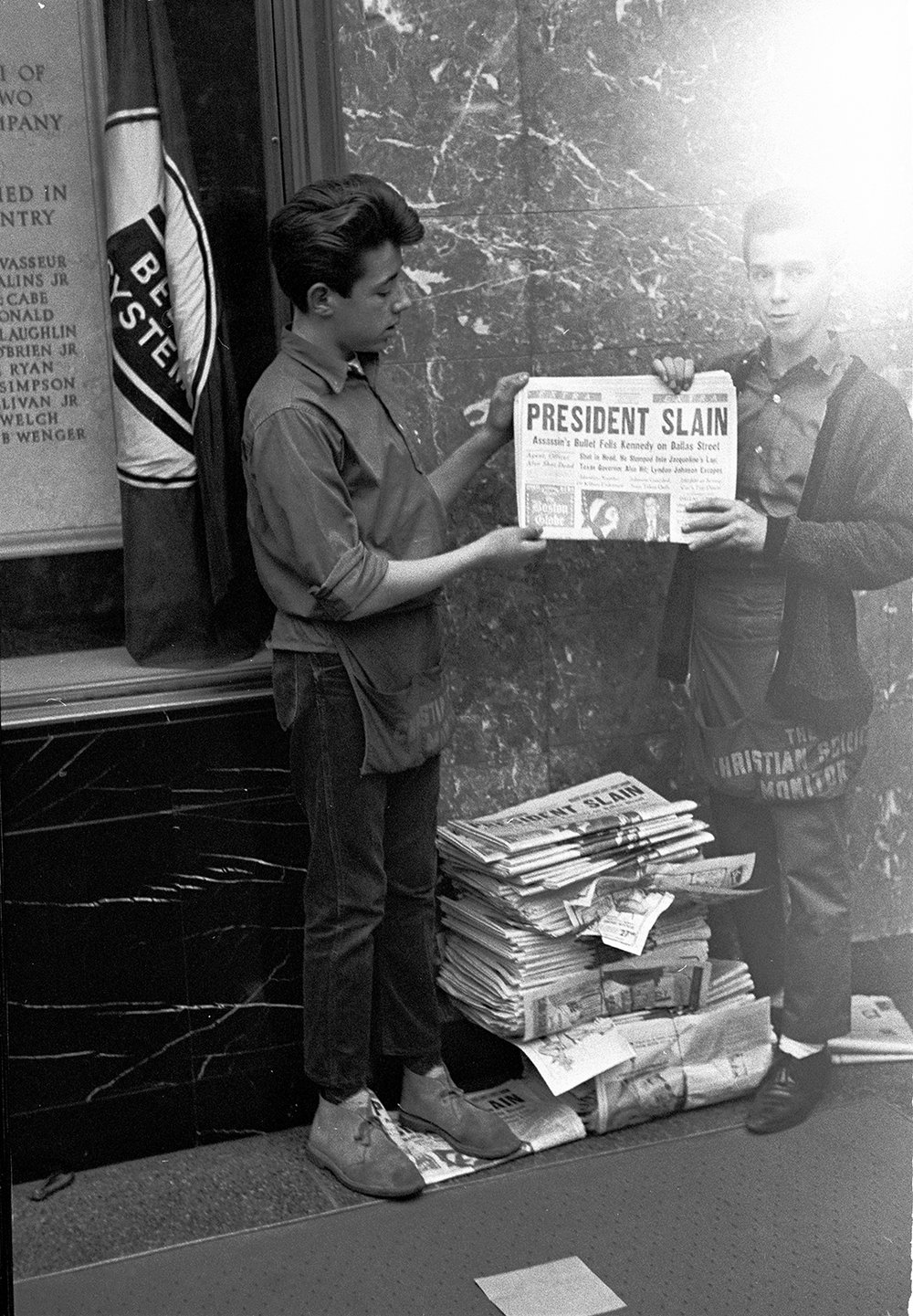 Image of President Slain..  Two News Boys Show Kennedy Cover