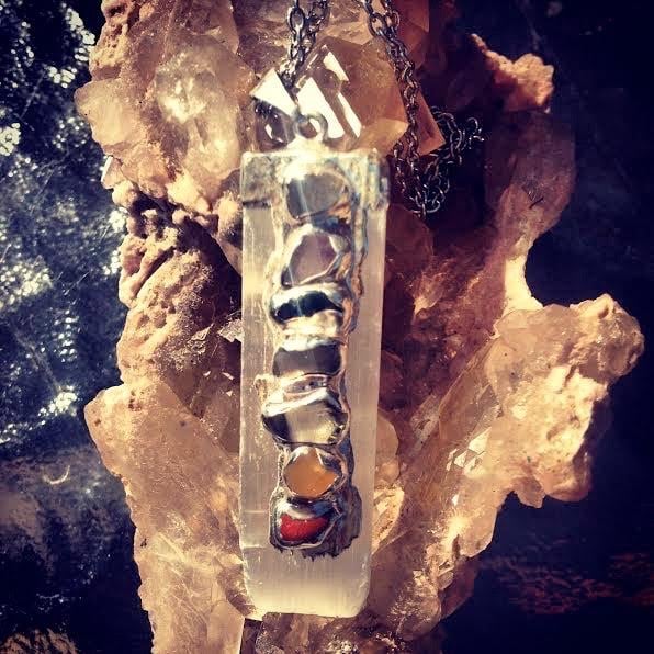 Image of Divine Authentic Beauty Chakra Pendant on Selenite