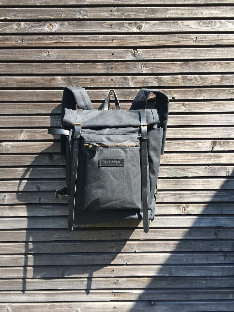 Image of Waxed canvas backpack with roll to close top and zipper outside pocket