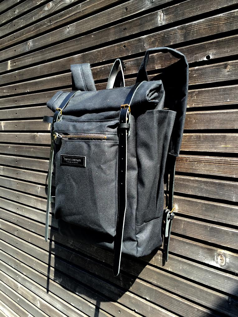 Image of Waxed canvas backpack with roll to close top and zipper outside pocket