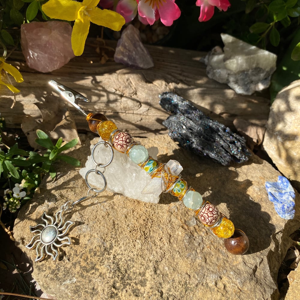 Image of sun flower roach clip