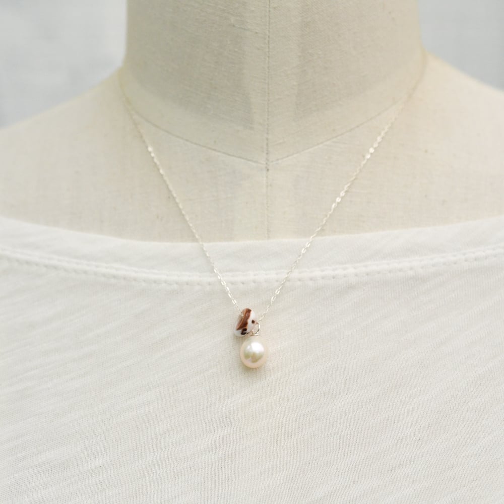 Image of Puka shell necklace cultured freshwater pearl