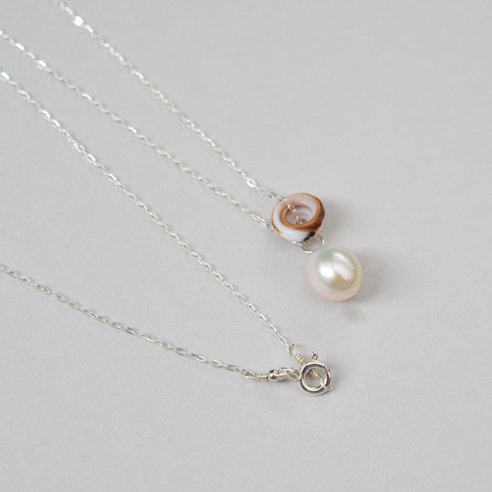 Image of Puka shell necklace cultured freshwater pearl
