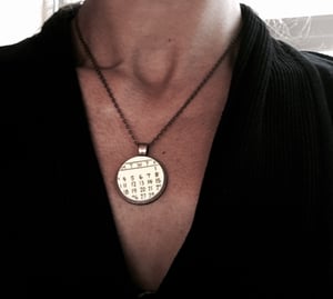 Image of Yellow Calendar Necklace 