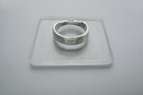 Image of silver classical ring with inscription in Latin
