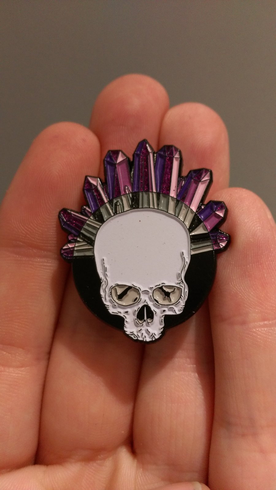 Image of crystal skull II lapel pin