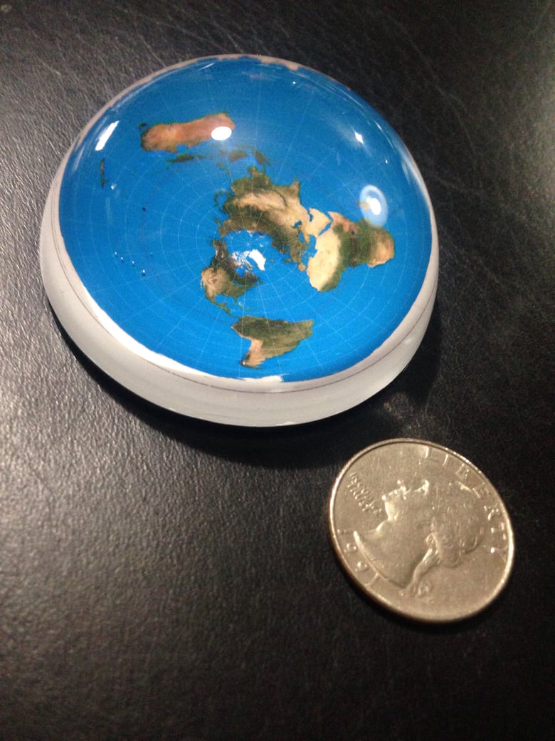 Image of 2 1/2 inch. Solid Crystal Flat Earth Paperweight.