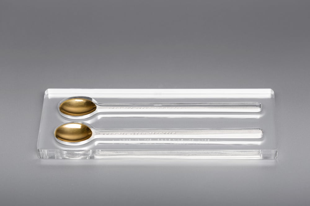 Image of silver long spoon set with gilding and inscription in Latin