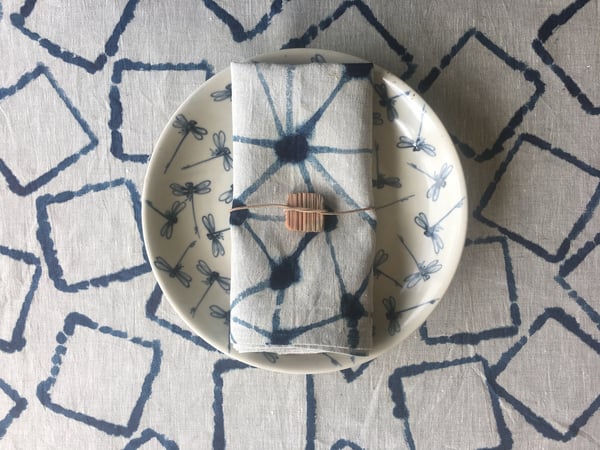 Image of 'chinese checkers' or 'scrabble' table linen