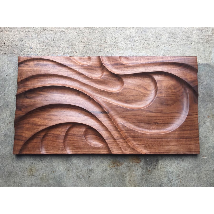 Image of Riptide. Walnut wall hanging.