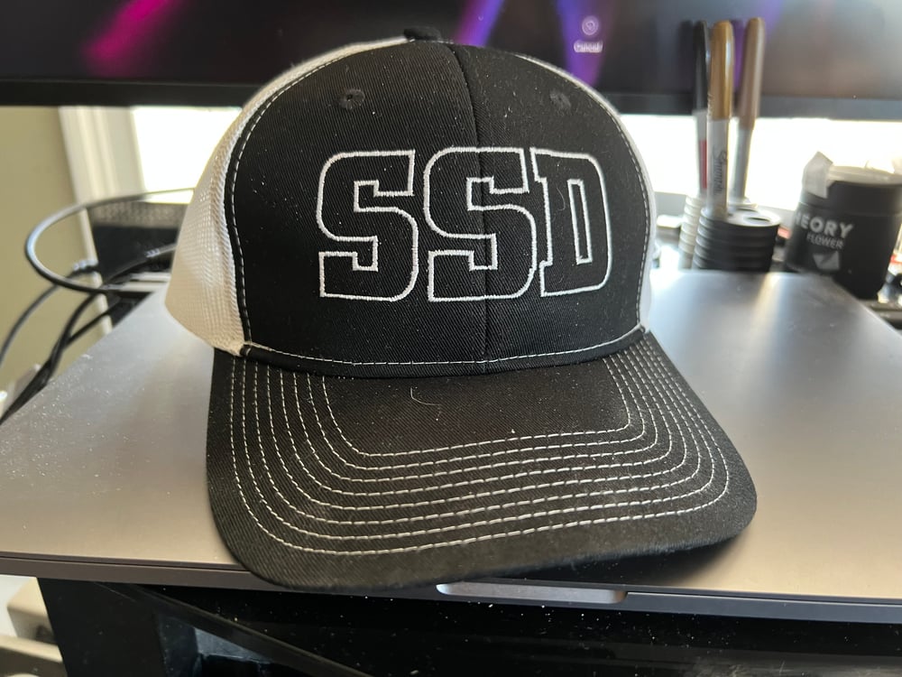 White SSD Outline Logo Snapback Black & White Trucker Cap