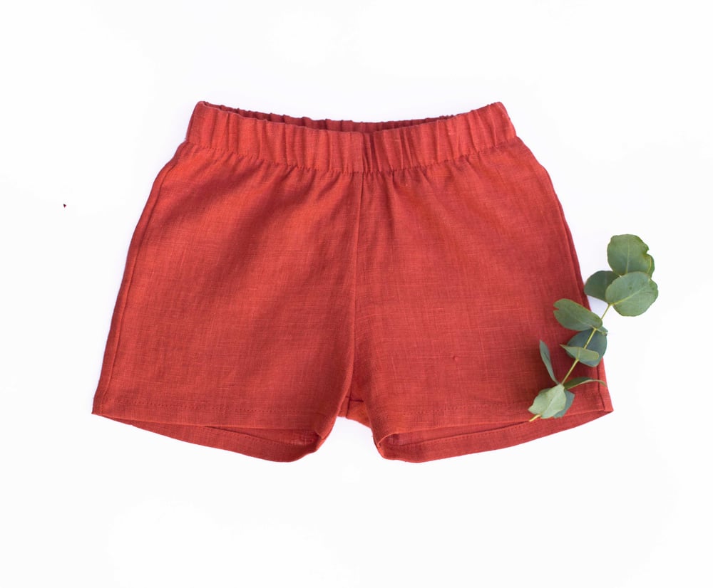 Image of burnt red linen shorts