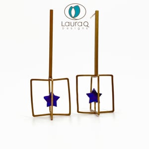 Star in a cage earrings
