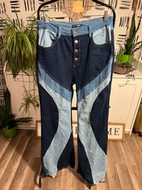 Image 1 of Fashion Nova patch work jeans 