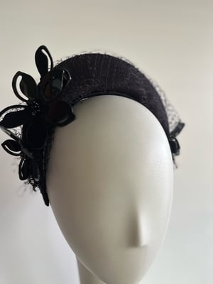 Image of Black felt halo w acrylic flowers.