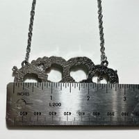 Image 3 of pink zombie brass knuckle necklace 