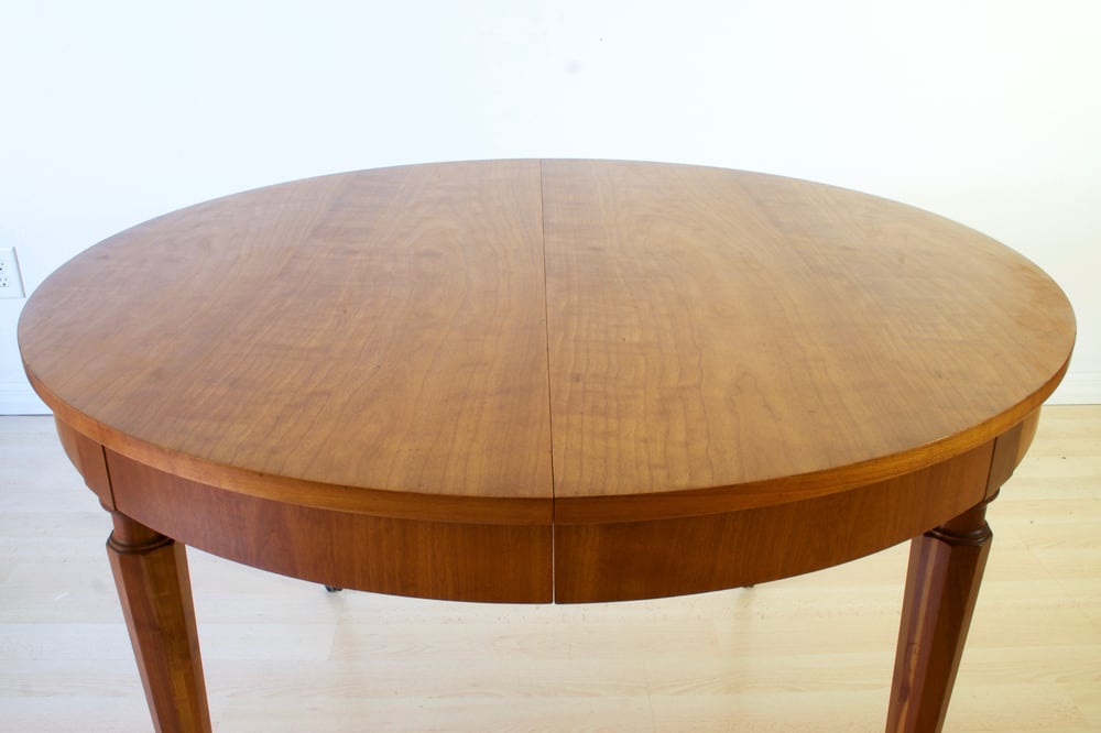 Round Dining Table Cherry Wood + Brass Casters / Dominique Provost