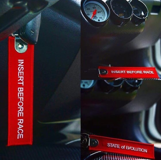 Image of INSERT BEFORE RACE -KEYCHAIN