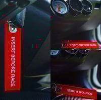 INSERT BEFORE RACE -KEYCHAIN