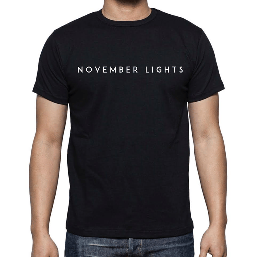 Image of Black November Lights chest design tee.
