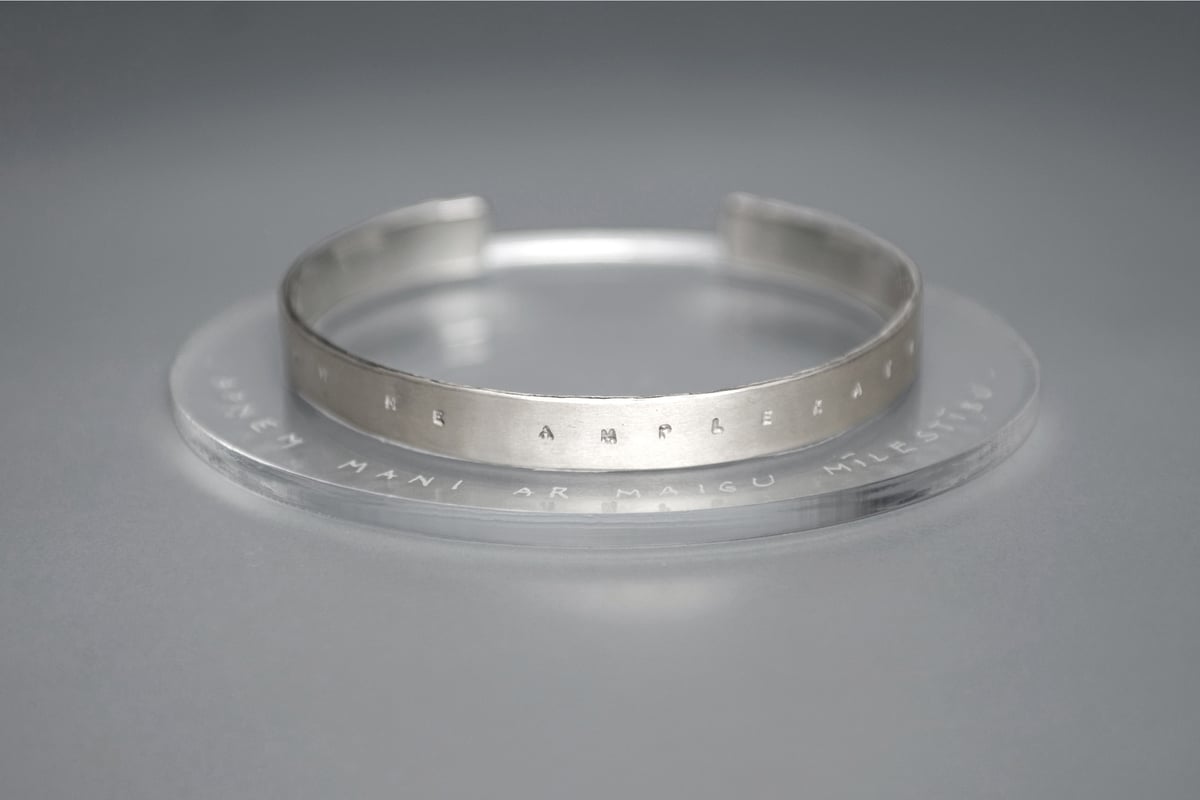 silver bracelet with inscription in Latin VERBA