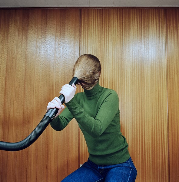 Image of Woman with Hair in Vacuum