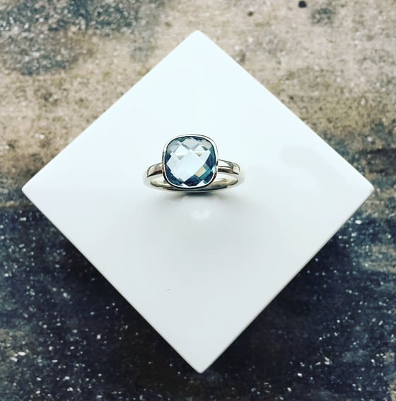 Image of Silver Ring set with a 10mm Cushion Cut Blue Topaz