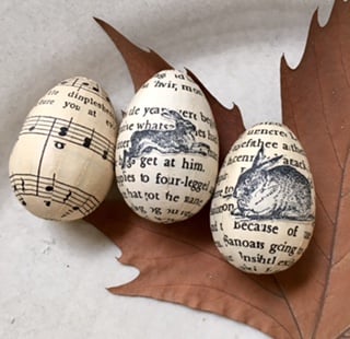 Image of Eggs covered in vintage book paper. 
