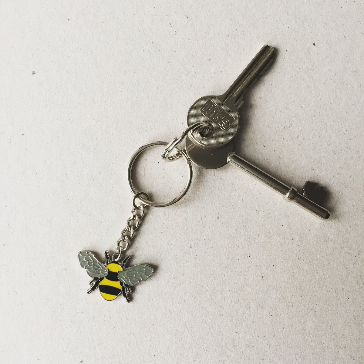Image of Manchester Bee BeeKeeper Enamel Keyring in Yellow