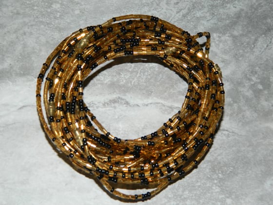 Image of Gold and black glass bead