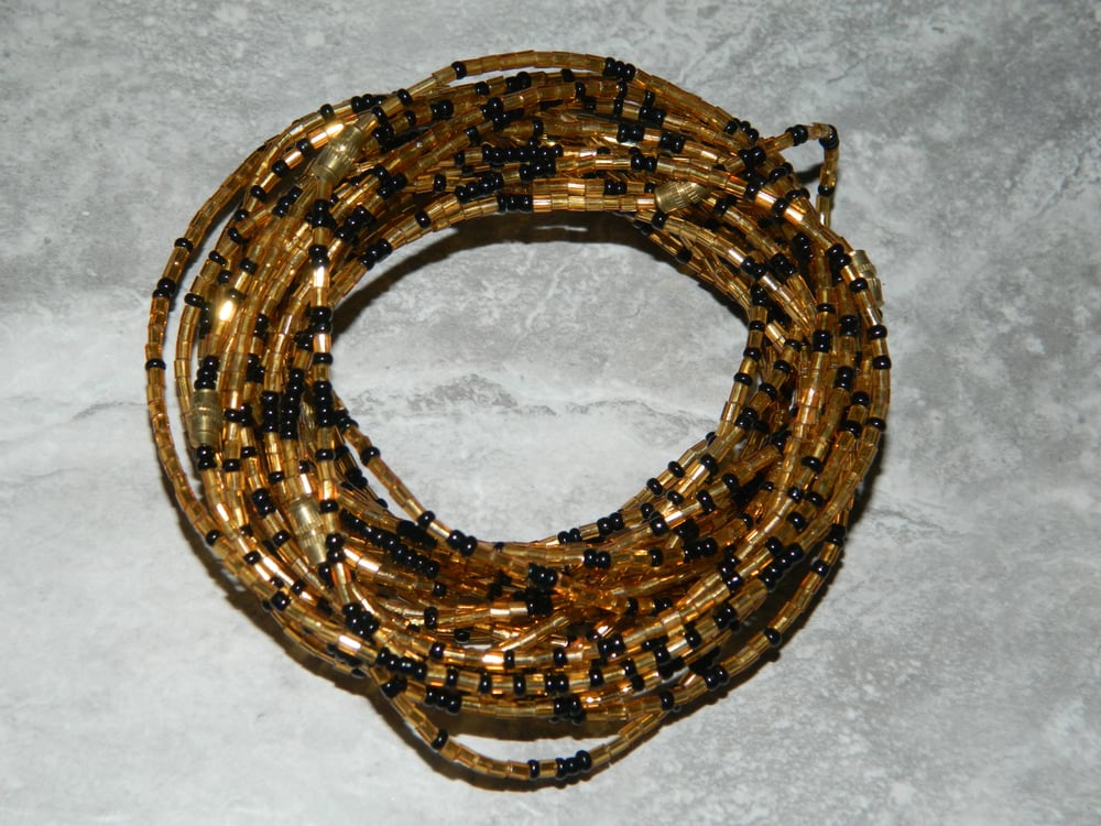 Image of Gold and black glass bead