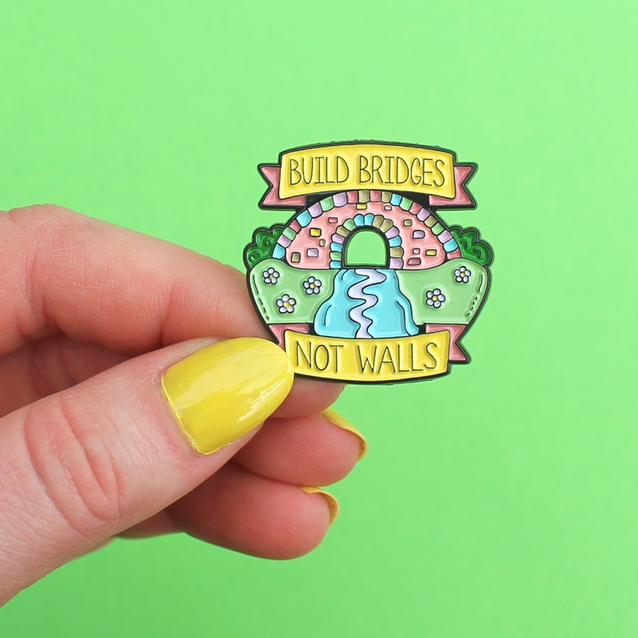 Image of 'Build Bridges Not Walls' enamel pin, rainbow, bridge - lapel pin