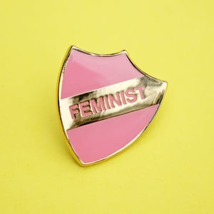 Image of FEMINIST - enamel pin, shield, pink with gold plating, merit style badge