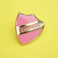 Image 1 of FEMINIST - enamel pin, shield, pink with gold plating, merit style badge