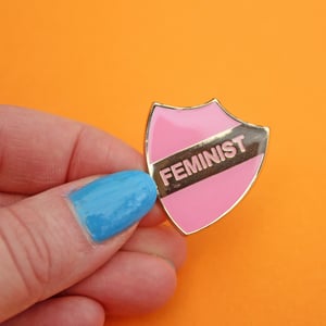 Image of FEMINIST - enamel pin, shield, pink with gold plating, merit style badge