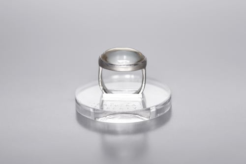 Image of silver ring with rock crystal and inscription in Latin