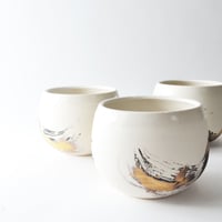 Image 2 of black and gold tumbler