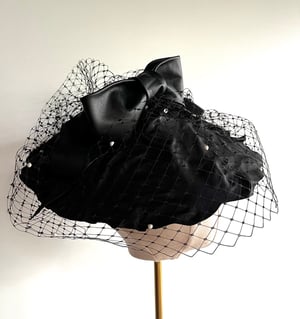 Image of Black leather saucer headpiece