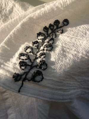 Image of botanical gris hand embroidered towel