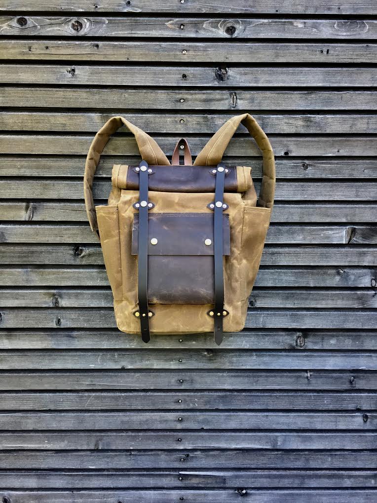 Image of Hipster Backpack in waxed canvas with roll up top and double bottle pocket