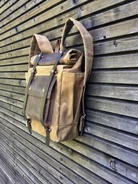 Image 2 of  Hipster Backpack in waxed canvas with roll up top and double bottle pocket