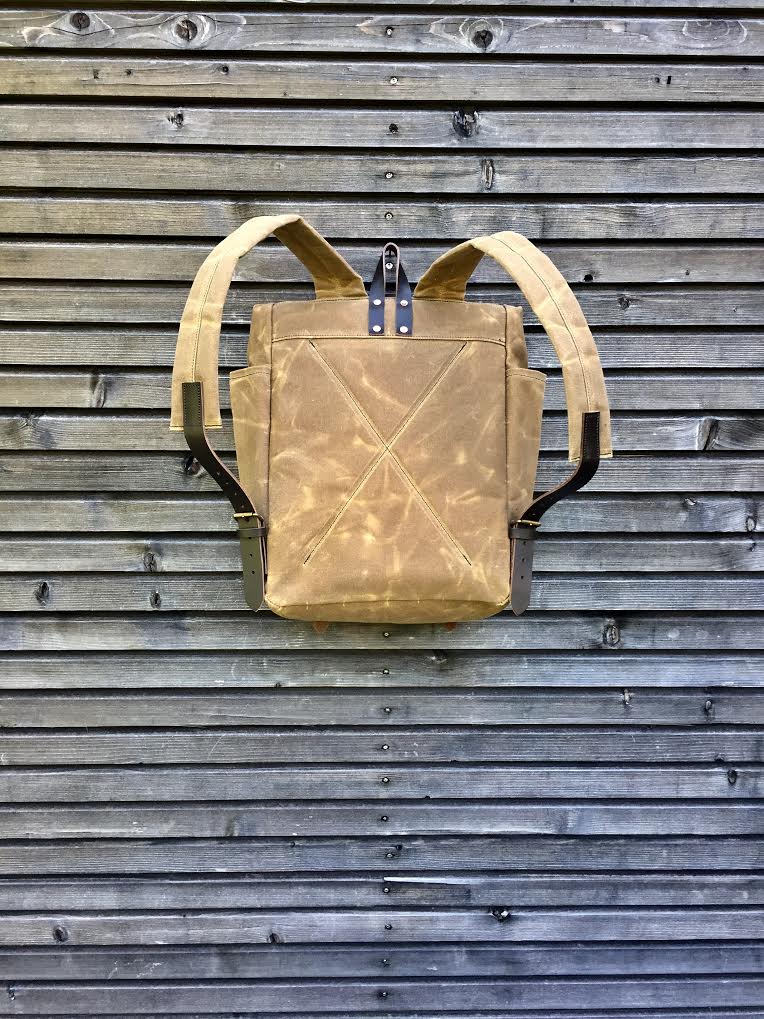 Image of  Hipster Backpack in waxed canvas with roll up top and double bottle pocket